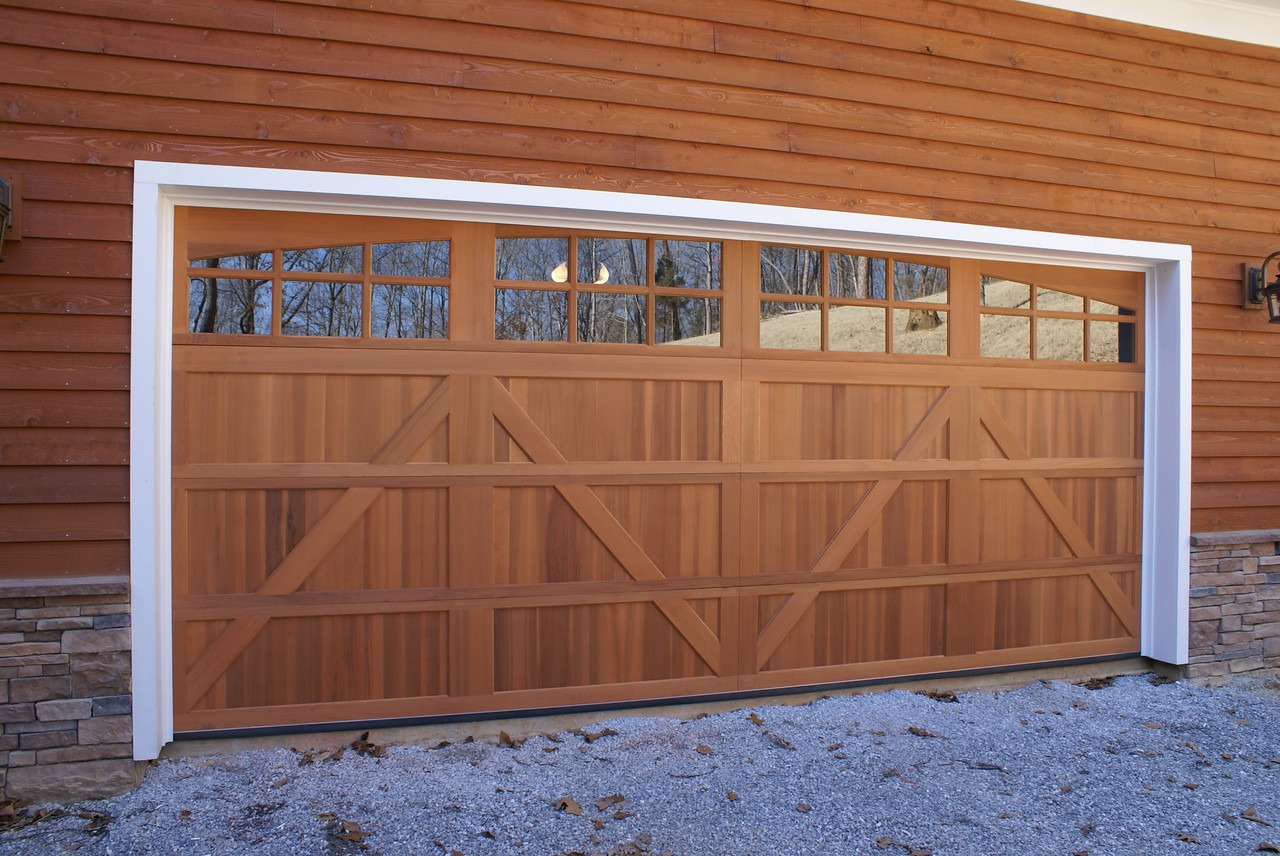 Custom wood garage door with an overlay.